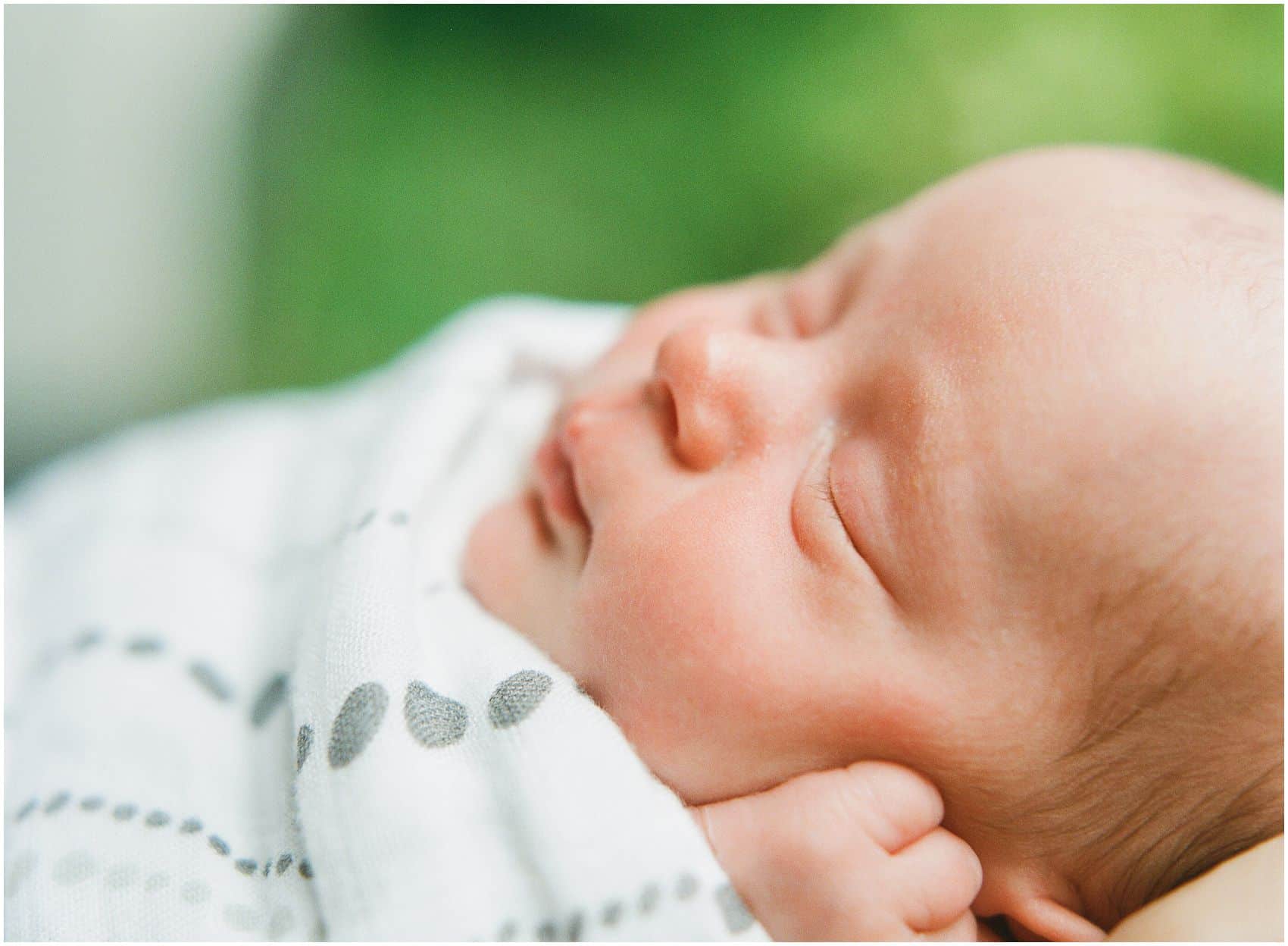 baby girl with squishy cheeks in newborn photos