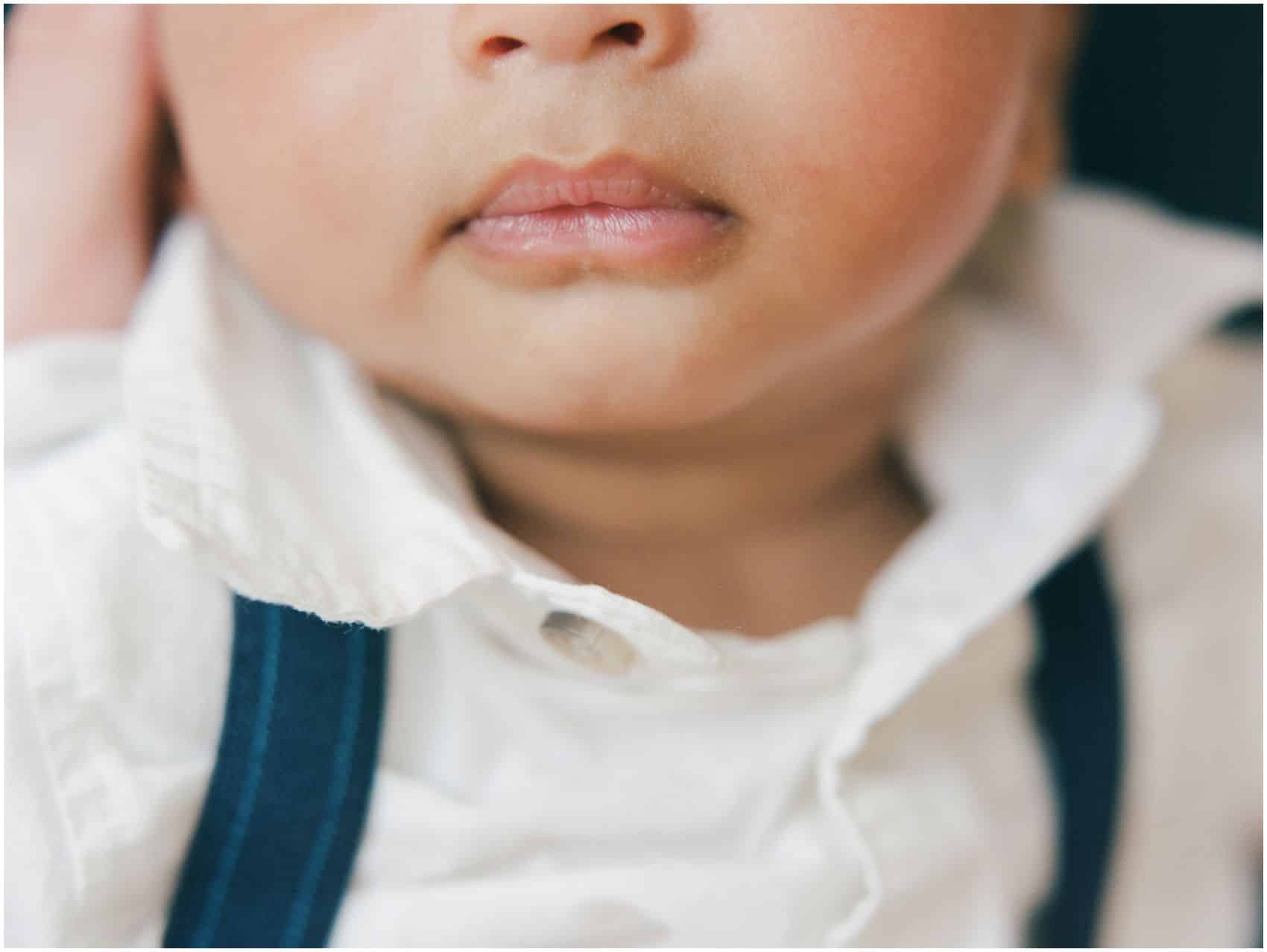 newborn photos in NYC with a close up of beautiful lips of a baby boy