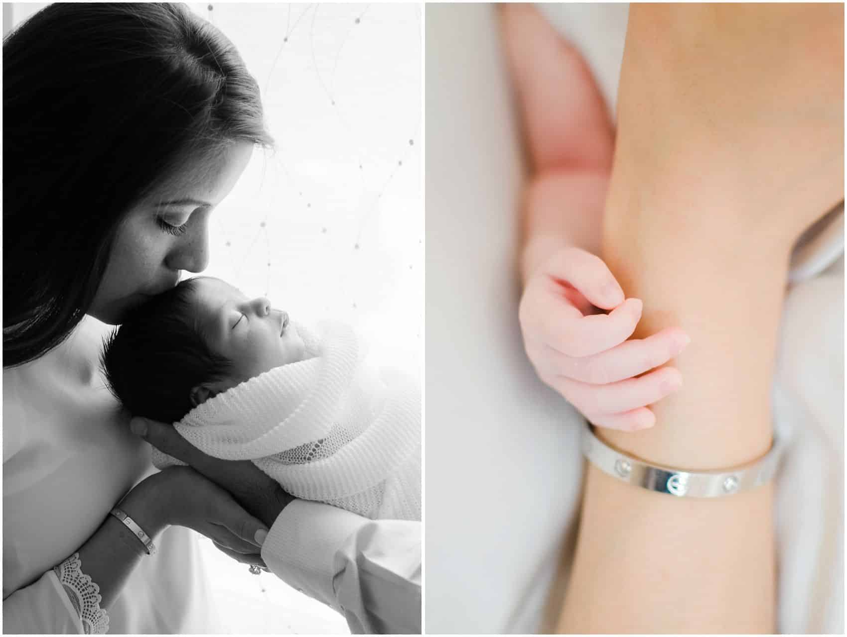 Intimate portraits in NYC of mom kissing her baby girl and holding her tiny hand