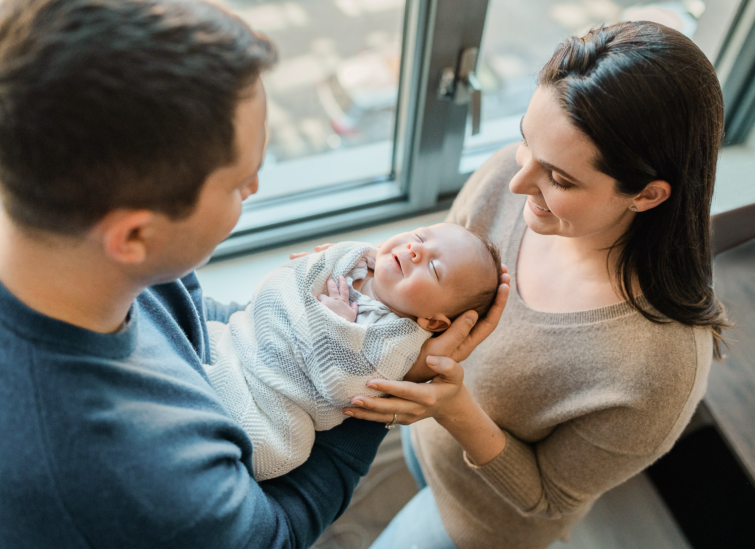 Family with newborn baby — in-home newborn photographer NJ