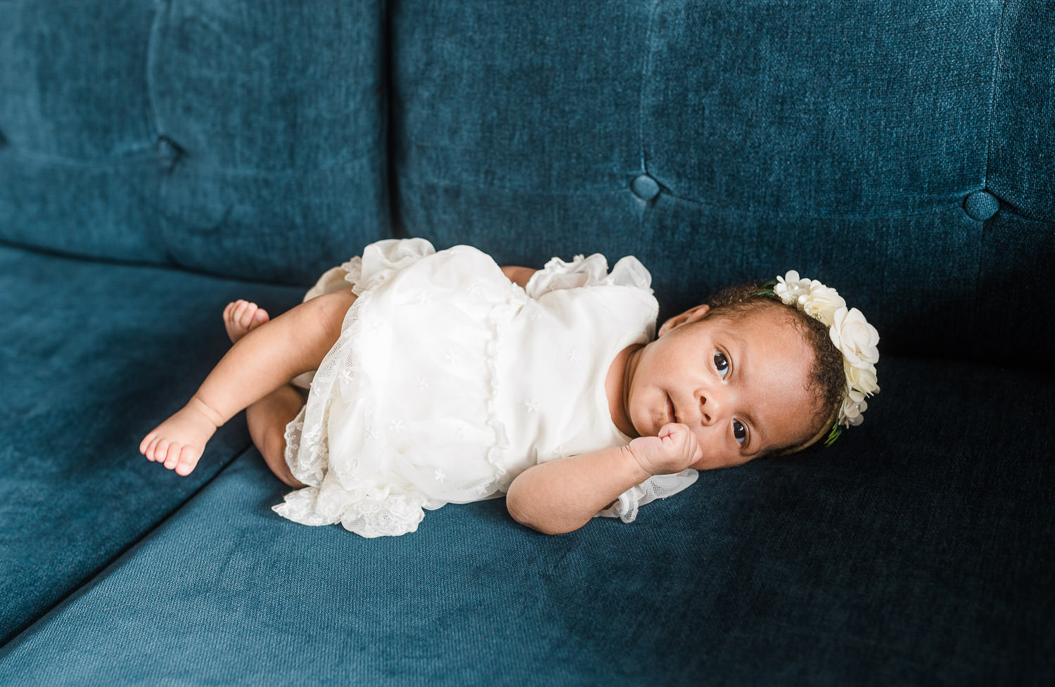 Awake and alert newborn baby with expressive face — lifestyle newborn photography