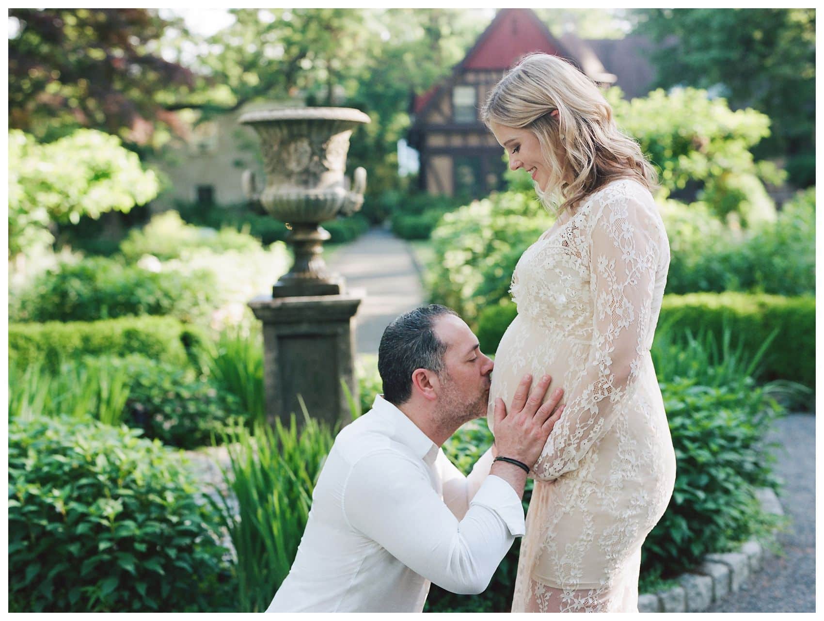 Husband kissing his wife belly a the best time for maternity session around 30 weeks in Montclair NJ Van Vleck House & Gardens