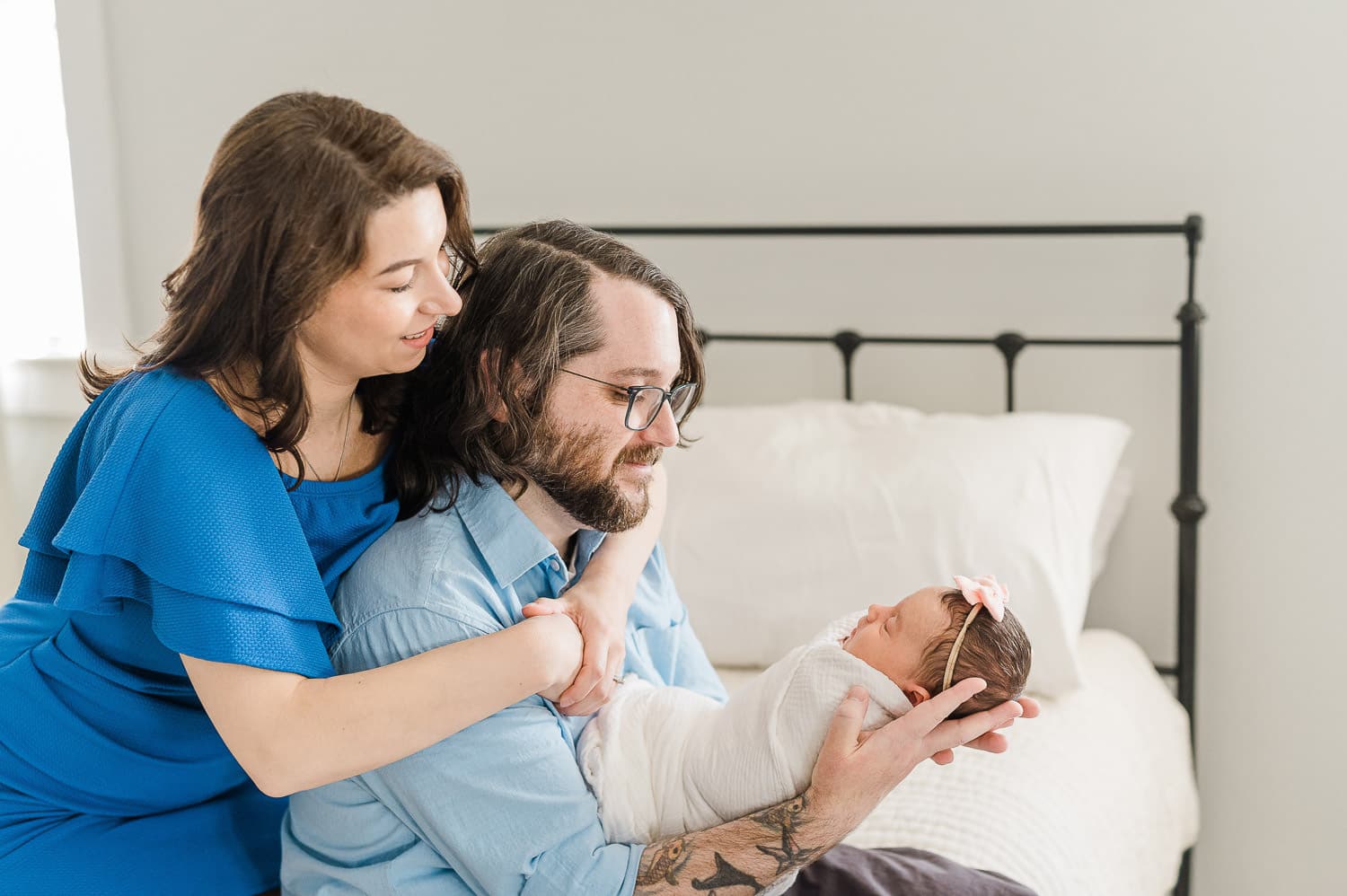 Manhattan apartment nursery setup for professional newborn photography with mom and dad holding their baby