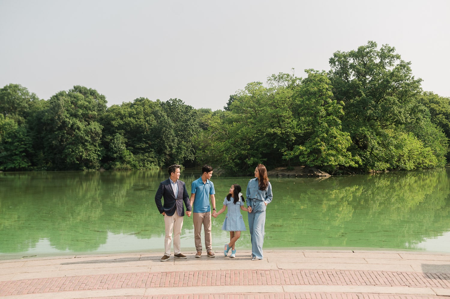 Professional Central Park family photography with Manhattan skyline backdrop NYC