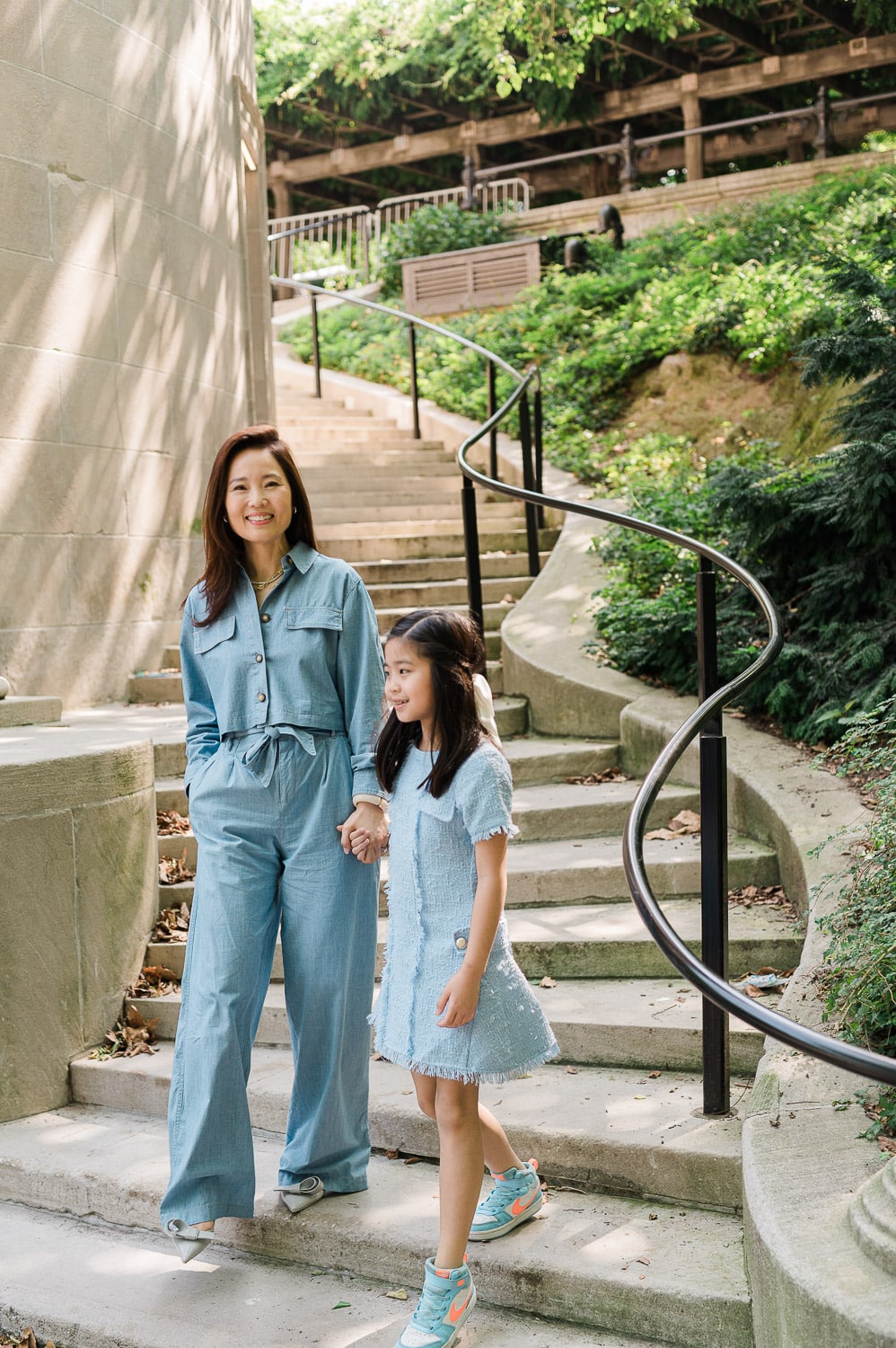 Fun mother and daughter portraits walking in Central Park during family photography session NYC
