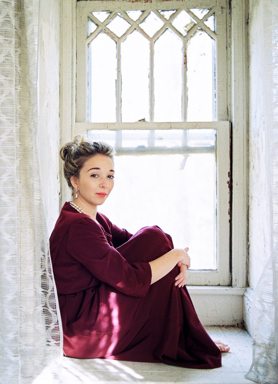 Senior portrait by window — high school senior photographer NJ