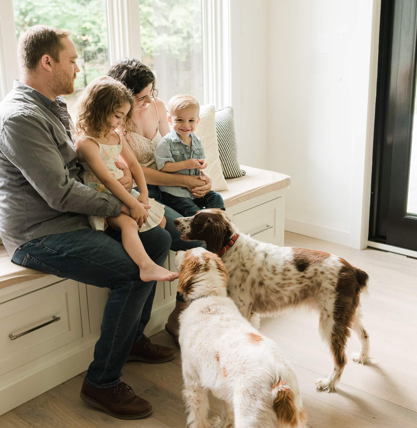 Candid shot of family laughing with pets, Summit, NJ photography