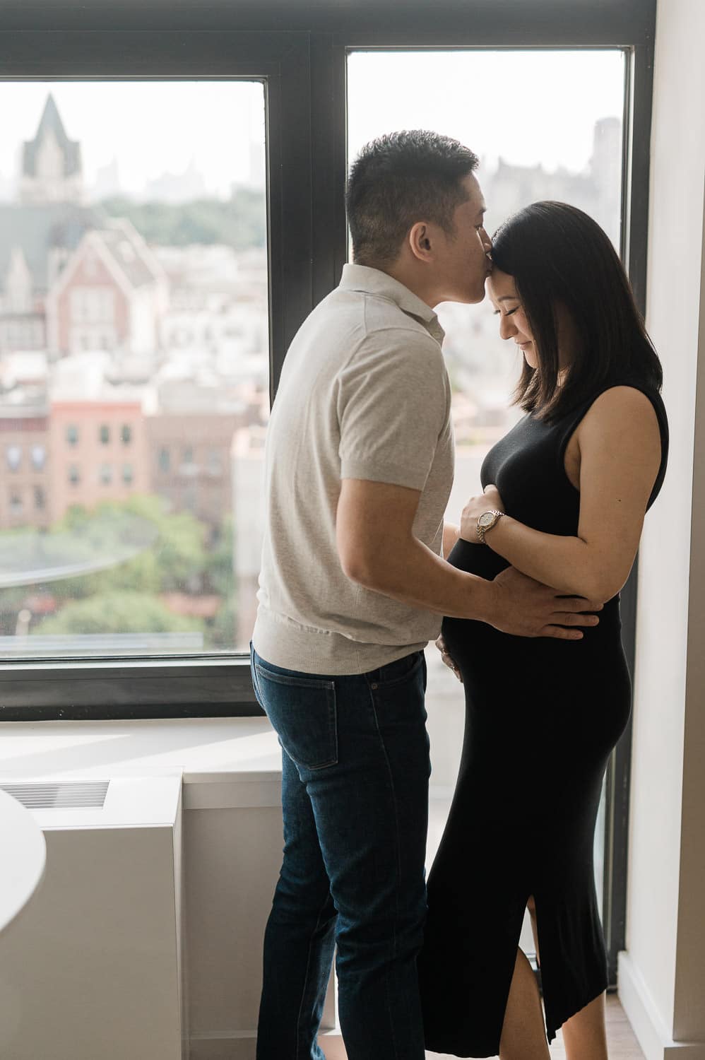 Best maternity photographer capturing an Expecting couple at their home at maternity photography session in Prospect Park, Brooklyn