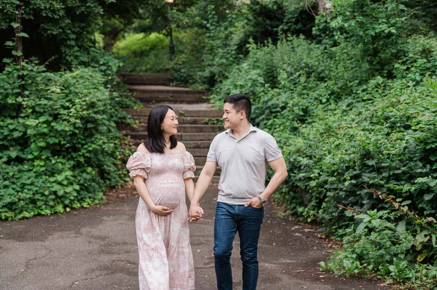 Relaxed couple walking during outdoor maternity session in Prospect Park Brooklyn