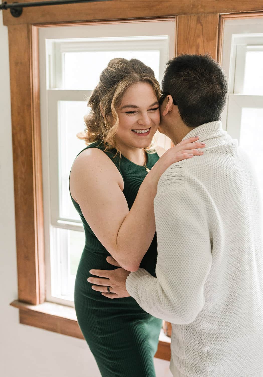 Soft indoor maternity photography in Morristown NJ with natural light and neutral tones